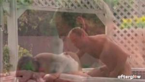 A real couple has romantic sex in a hot tub