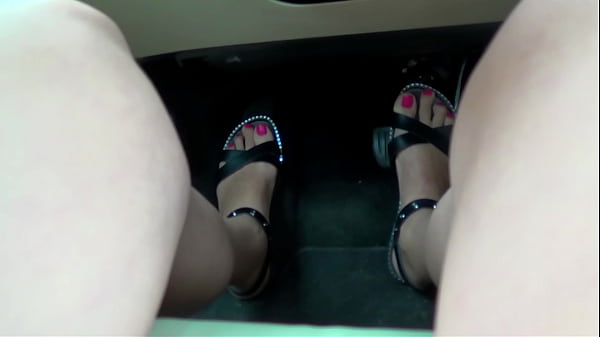 Hot Skinny MILF Operates the Pedals in the Car and Gives Footjob