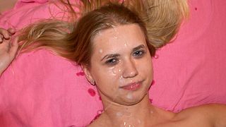 Rough condom blowjob ends in massive facial on small-titted blonde