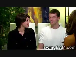 Brunette and her man get interviewed by a XXX reality show of swinger couples